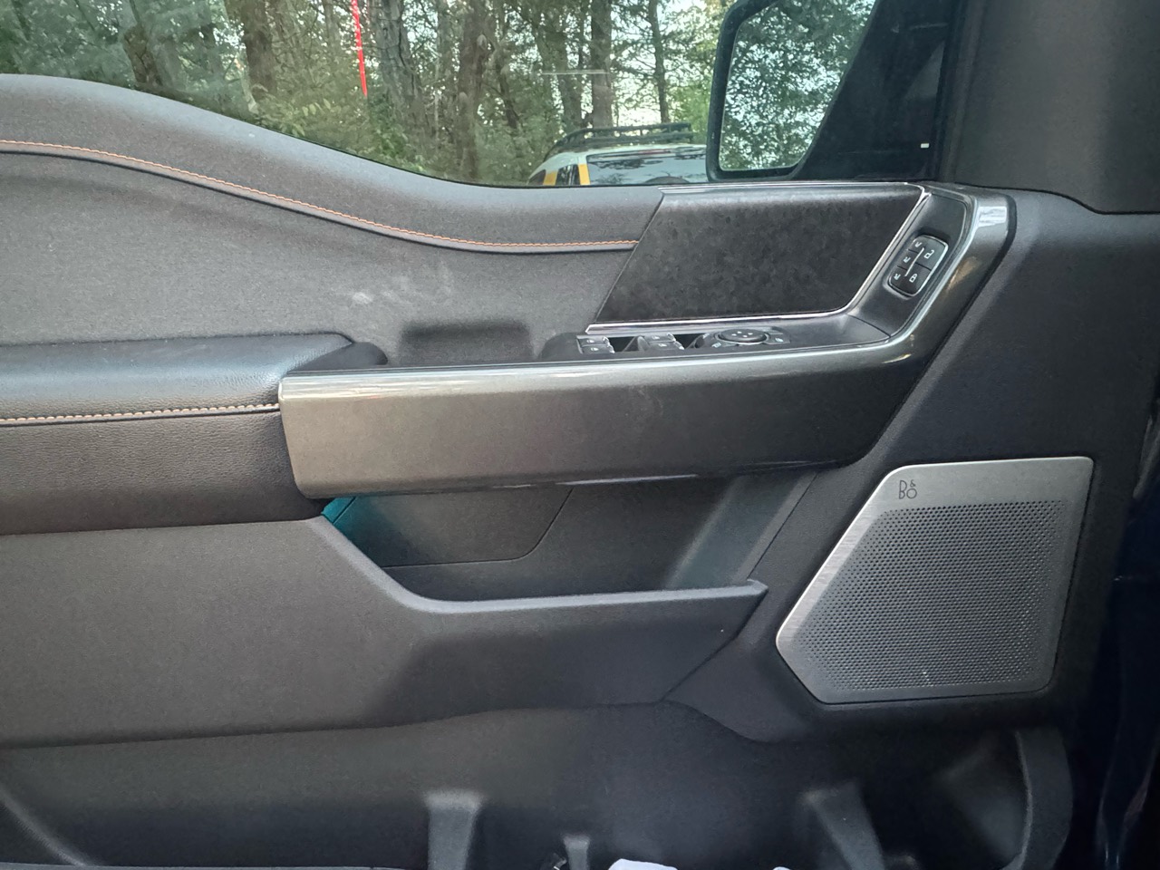 Before detailing: driver-side interior door panel and armrest